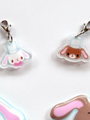 A pair of acrylic pendants.