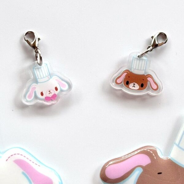 A pair of acrylic pendants.